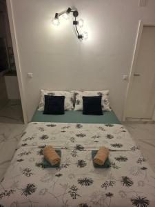 a bedroom with a bed with two pillows on it at Studio apartman Franka in Vukovar