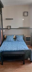 Llit o llits en una habitació de Appartement C - Centre PONS