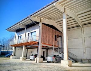 a building with a balcony on the side of it at La Mandulera in Rivalta di Torino
