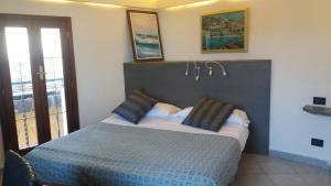 A bed or beds in a room at Affittacamere Elisabetta
