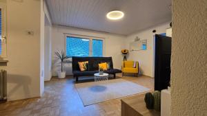 a living room with a couch and a yellow chair at Hike, Bike & More in Parcines