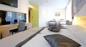 Letto o letti in una camera di Hotel Grad