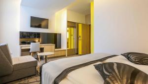 Letto o letti in una camera di Hotel Grad