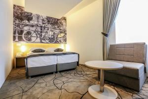 Letto o letti in una camera di Hotel Grad