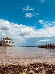 a boat is docked at a dock on the water at Ferienwohnung Ewa in Grassau
