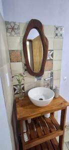 a bathroom with a sink and a mirror at Cabaña Rincón de Afrodita in San Lorenzo +72 photos
