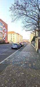 a car parked on the side of a street at UNEA Aparthotel in Leipzig - Vollausgestattete Apartments in Leipzig