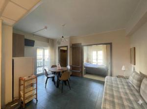 a room with a bed and a table and a bedroom at Casavacanze Internazionale in Diano Marina
