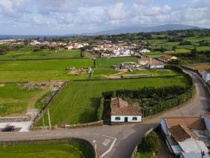 an aerial view of a small village with a road at Rustic House - Eco Farm Living in Capelas