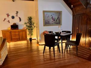 a dining room with a table and chairs at Six Pillars Resort in Bocas Town