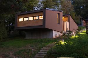 a small house with a window on the side of it at BLOK Wood Cottage in Visoko