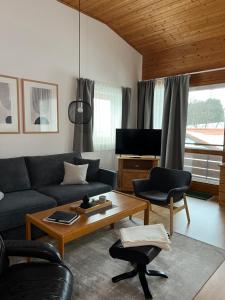 Khu vực ghế ngồi tại Ferienwohnung Markt Eging am See Bayerischer Wald