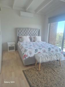 En eller flere senge i et værelse på Family Beach Home Dromana