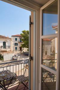 a view from a window of a balcony at Galaxidaki στην Πλατεία in Galaxidi