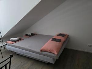 a bed sitting in a room under a stairs at Ana i Marko in Vodice