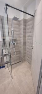a shower with a glass door in a bathroom at Ana i Marko in Vodice +26 photos