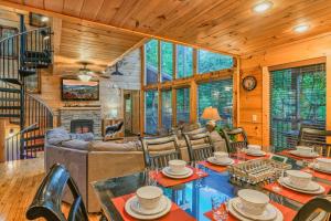 a living room filled with furniture and a fireplace at Goonies Cove - Spacious 4BR Cabin Arcade, Pool Table & Hot Tub! in Sevierville