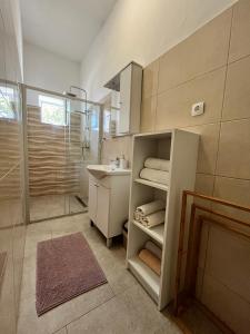 a bathroom with a sink and a shower at Apartmani "Nikola" Seaview - Ivan Dolac, Hvar in Ivan Dolac +152 photos