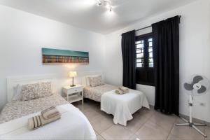 Giường trong phòng chung tại E6 Las Tabaibas +15 ảnh