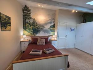 Giường trong phòng chung tại Les Quatre Saisons