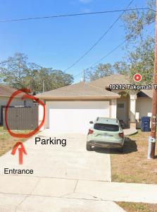 a car parked in the driveway of a house at Apartment in Tampa