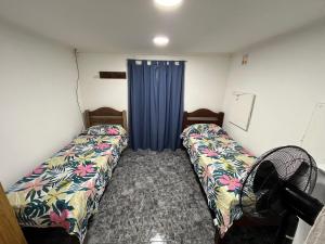 En eller flere senge i et værelse på Luz de mar