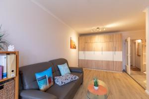 a living room with a couch and a table at Haus Knechtsand, Whg 433 in Cuxhaven