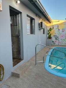 a house with a swimming pool on the side of it at Canto do viajante in São Gabriel