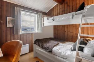 a bedroom with two bunk beds and a window at TH616- Large ski-in out cabin in Trysilfjell for 14 guests in Trysil +21 photos