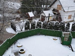 an aerial view of a yard covered in snow at Vila Raj in Gornja Toplica