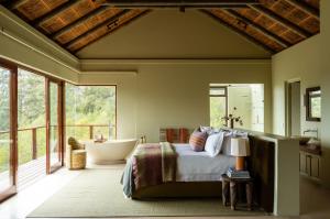 En eller flere senge i et værelse på Tamodi Estate