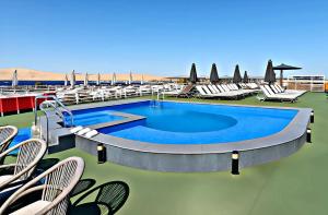 a swimming pool on the deck of a cruise ship at Five-Star Deluxe River Kruz from Aswan to Luxor 3 Nights in Aswān