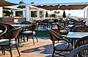 a row of tables and chairs on a patio at Five-Star Deluxe River Kruz from Aswan to Luxor 3 Nights in Aswān