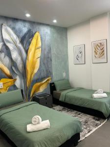 a room with two beds and a mural on the wall at Aura Apartment 2 Herne in Herne
