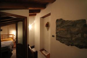 Posteľ alebo postele v izbe v ubytovaní B&B Vecchio Torchio di Bard