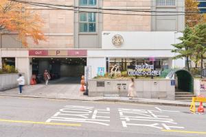 a street in front of a building with a store at Gangnam Opal in Seoul