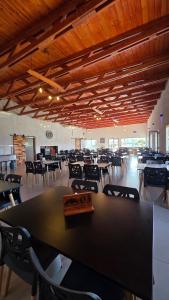 a large dining room with tables and chairs at Complejo Gran Chacha in Tanti