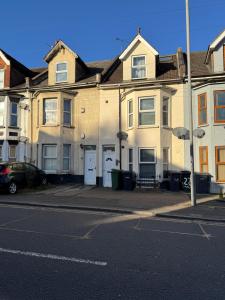 a row of houses on a city street at Studio with en suite, compact and comfortable for 1-2 people in Luton