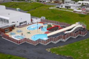 an aerial view of a water park with a water slide at Þórsheimili - Rooms in Vestmannaeyjar
