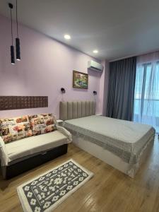 Giường trong phòng chung tại Bamboo Beach Tsikhisdziri +46 ảnh