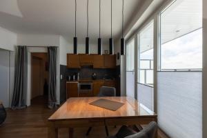 a kitchen with a wooden table in a room at Haus Medemsand, Whg 221 in Duhnen