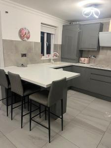 a kitchen with a table and chairs in it at Pats Place in Liverpool