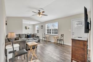 a living room with a couch and a table at Red Ranch Bring Your Dogs! Fenced Yard in Clarksville