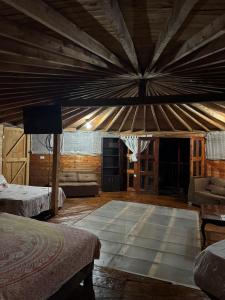a large room with a large wooden ceiling at Cabaña Privada Pachamama Ancestral in Medellín