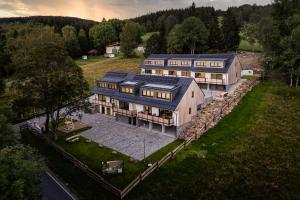 an aerial view of a large house with at Horský sen - Mountain Dream Apartment B1 in Špičák