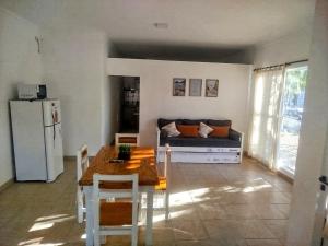 a living room with a table and a couch at La Esquina de Norma in General Villegas