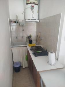 a kitchen with a stove and a sink at La Esquina de Norma in General Villegas