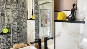 a bathroom with a shower with a mirror and a sink at Personal blue house Madeira in Santa Cruz +57 photos