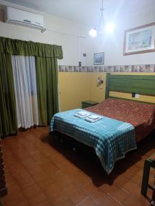 En eller flere senge i et værelse på Hotel & Restaurant Las Brisas