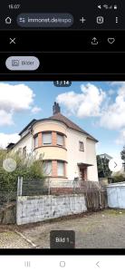 a screenshot of a house with a picture of it at Inna's and Dima's Ferienwohnung in Pirmasens
